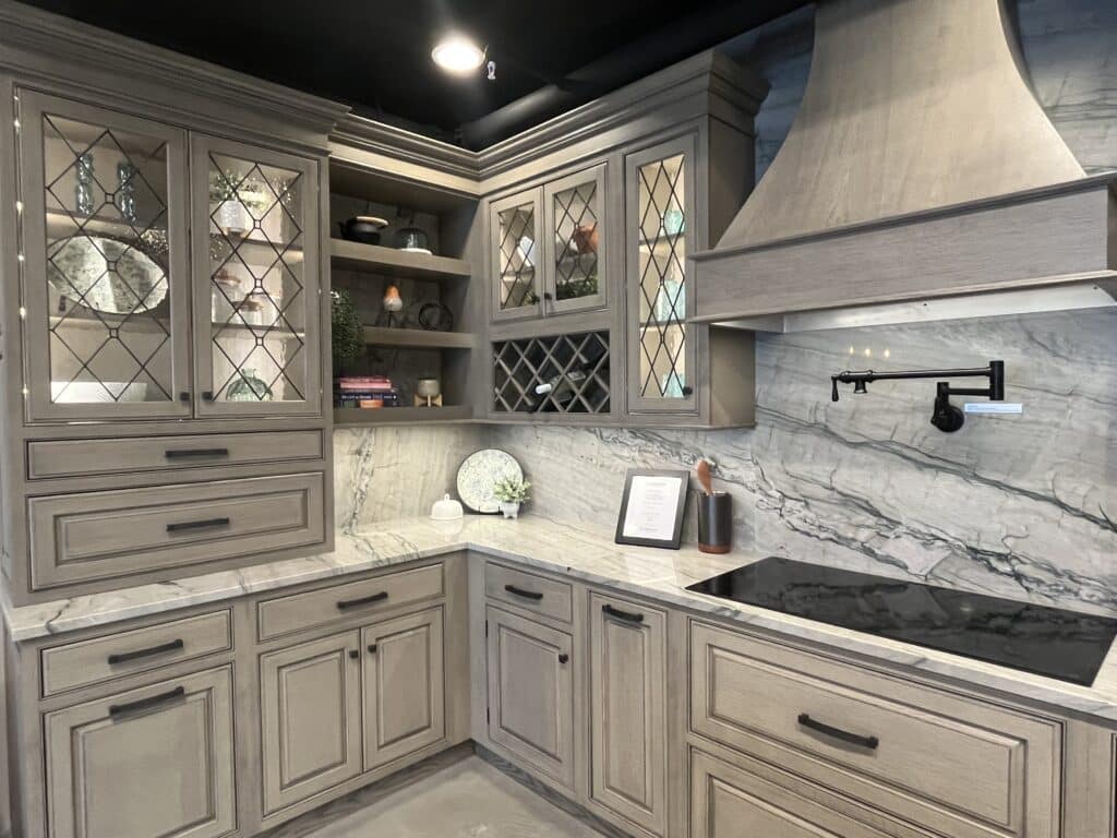 Modern kitchen featuring a durable stone countertop and full-height stone backsplash