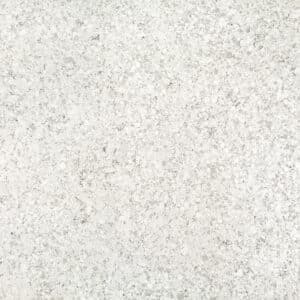 Close-up of a pale gray speckled terrazzo/concrete surface.