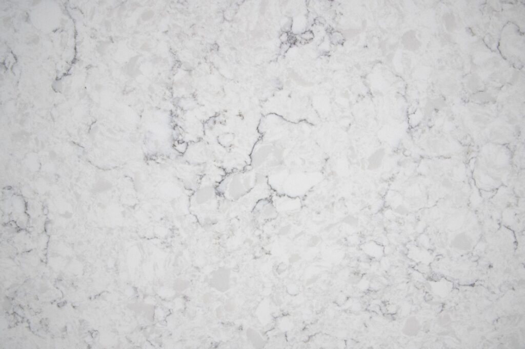 White marble texture with subtle gray veining suitable as a background.