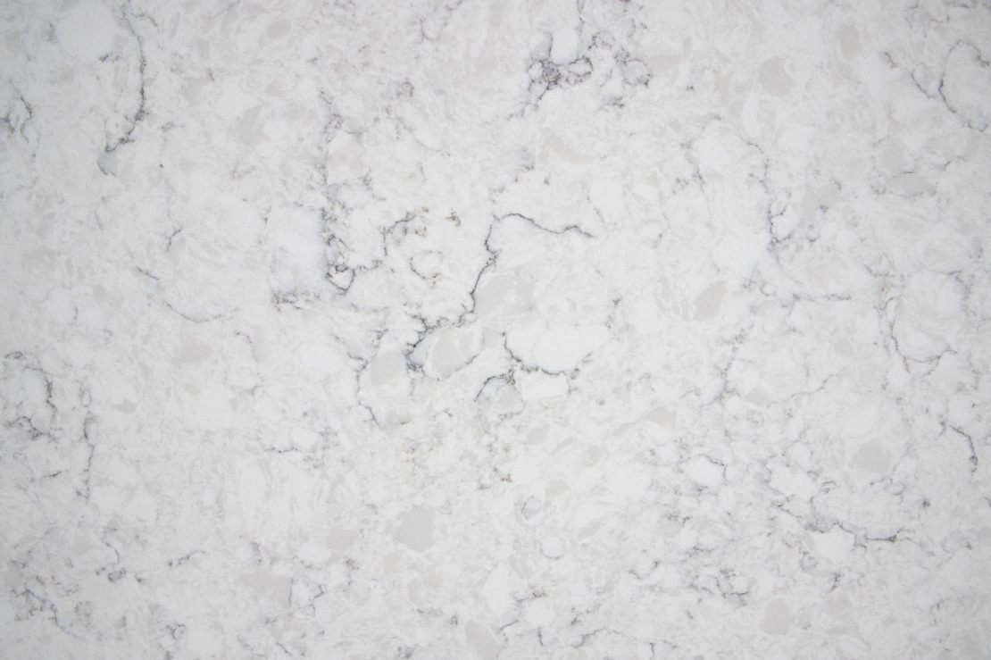 White marble texture with subtle gray veining suitable as a background.