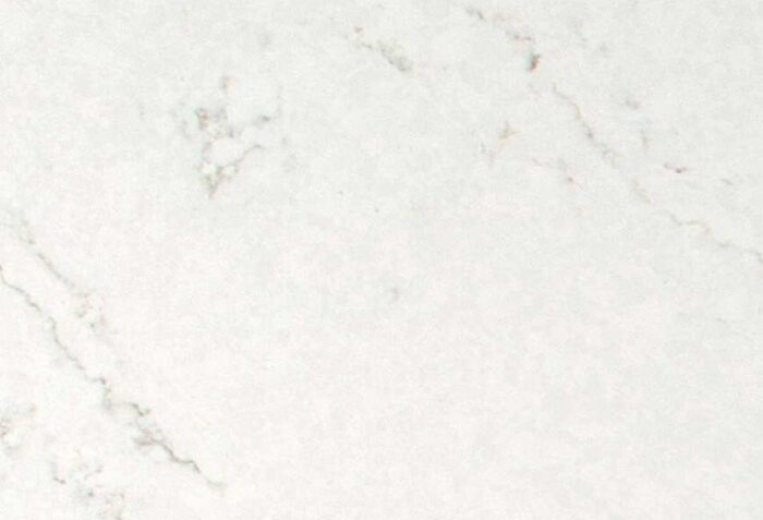 White marble surface with subtle gray veining across the tile