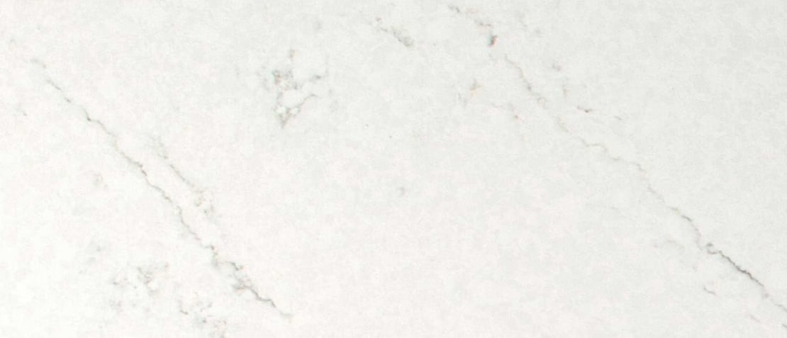White marble surface with subtle gray veining across the tile